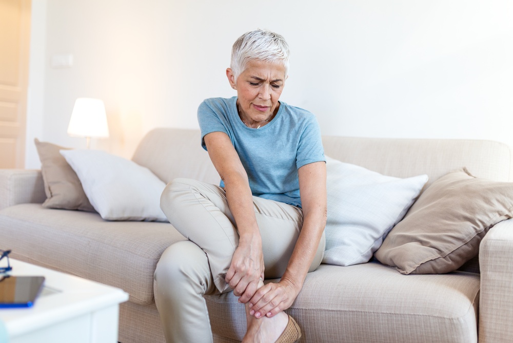 Mature woman with aching leg problem