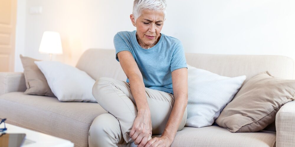 Mature woman with aching leg problem
